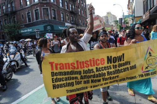 The TransJustice Banner leading a march of over 600 people from the Piers